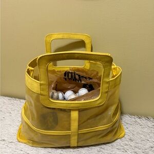Yellow Mesh Tote Bag full of Golf Balls